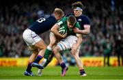 19 March 2022; Garry Ringrose of Ireland is tackled by Chris Harris and Rory Darge of Scotland during the Guinness Six Nations Rugby Championship match between Ireland and Scotland at Aviva Stadium in Dublin. Photo by Harry Murphy/Sportsfile