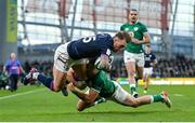 19 March 2022; Stuart Hogg of Scotland is tackled by Hugo Keenan of Ireland during the Guinness Six Nations Rugby Championship match between Ireland and Scotland at Aviva Stadium in Dublin. Photo by Ramsey Cardy/Sportsfile