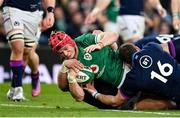 19 March 2022; Josh van der Flier of Ireland dives over to score his side's third try despite the tackle of Pierre Schoeman and Fraser Brown of Scotland during the Guinness Six Nations Rugby Championship match between Ireland and Scotland at Aviva Stadium in Dublin. Photo by Brendan Moran/Sportsfile