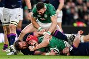 19 March 2022; Josh van der Flier of Ireland celebrates with teammate Robbie Henshaw, top, after scoring their side's third try during the Guinness Six Nations Rugby Championship match between Ireland and Scotland at Aviva Stadium in Dublin. Photo by Brendan Moran/Sportsfile