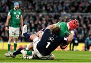 19 March 2022; Josh van der Flier of Ireland dives over to score his side's third try despite the tackle of Pierre Schoeman and Fraser Brown of Scotland during the Guinness Six Nations Rugby Championship match between Ireland and Scotland at Aviva Stadium in Dublin. Photo by Harry Murphy/Sportsfile