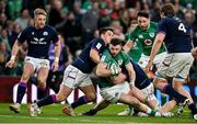 19 March 2022; Robbie Henshaw of Ireland is tackled short of the try-line by Sam Johnson of Scotland during the Guinness Six Nations Rugby Championship match between Ireland and Scotland at Aviva Stadium in Dublin. Photo by Brendan Moran/Sportsfile
