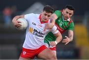 19 March 2022; Michael McKernan of Tyrone in action against Jason Doherty of Mayo during the Allianz Football League Division 1 match between Tyrone and Mayo at O'Neill's Healy Park in Omagh, Tyrone. Photo by Stephen McCarthy/Sportsfile