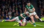19 March 2022; James Lowe of Ireland is tackled by Darcy Graham of Scotland during the Guinness Six Nations Rugby Championship match between Ireland and Scotland at Aviva Stadium in Dublin. Photo by Brendan Moran/Sportsfile
