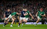 19 March 2022; Mark Bennett of Scotland evades the tackle of Robbie Henshaw of Ireland during the Guinness Six Nations Rugby Championship match between Ireland and Scotland at Aviva Stadium in Dublin. Photo by Ramsey Cardy/Sportsfile