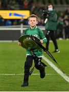 19 March 2022; Luca Sexton, son of Ireland captain Jonathan Sexton, runs with The Triple Crown trophy after the Guinness Six Nations Rugby Championship match between Ireland and Scotland at Aviva Stadium in Dublin. Photo by Harry Murphy/Sportsfile