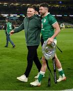 19 March 2022; Hugo Keenan, right, and Andrew Conway of Ireland with The Triple Crown Trophy after the Guinness Six Nations Rugby Championship match between Ireland and Scotland at Aviva Stadium in Dublin. Photo by Harry Murphy/Sportsfile