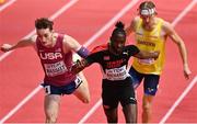 19 March 2022; Jereem Richards of Trinidad and Tobago, centre, crosses the line to win the men's 400m final from Trevor Bassitt of USA, left, and Carl Bengtström of Sweden, right, during day two of the World Indoor Athletics Championships at the Stark Arena in Belgrade, Serbia. Photo by Sam Barnes/Sportsfile