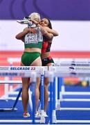 19 March 2022; Sarah Lavin of Ireland embraces Mujinga Kambundji of Switzerland after she fell whilst competing in the women's 60m hurdles final during day two of the World Indoor Athletics Championships at the Stark Arena in Belgrade, Serbia. Photo by Sam Barnes/Sportsfile