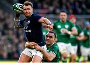 19 March 2022; Stuart Hogg of Scotland is tackled by James Lowe of Ireland during the Guinness Six Nations Rugby Championship match between Ireland and Scotland at the Aviva Stadium in Dublin. Photo by Harry Murphy/Sportsfile