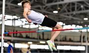 20 March 2022; Alex Heeney of Clane AC, Kildare, competing in the men's U16 High Jump during day two of the Irish Life Health National Juvenile Indoors at the Athlone Institute of Technology in Athlone, Westmeath. Photo by Ben McShane/Sportsfile