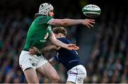 19 March 2022; Mack Hansen of Ireland is tackled by Darcy Graham of Scotland during the Guinness Six Nations Rugby Championship match between Ireland and Scotland at Aviva Stadium in Dublin. Photo by Brendan Moran/Sportsfile