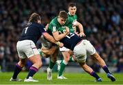 19 March 2022; Garry Ringrose of Ireland is tackled by Pierre Schoeman and Chris Harris of Scotland  during the Guinness Six Nations Rugby Championship match between Ireland and Scotland at Aviva Stadium in Dublin. Photo by Brendan Moran/Sportsfile
