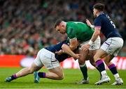 19 March 2022; Dave Kilcoyne of Ireland is tackled by WP Nel and Ali Price of Scotland during the Guinness Six Nations Rugby Championship match between Ireland and Scotland at Aviva Stadium in Dublin. Photo by Brendan Moran/Sportsfile