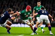 19 March 2022; Josh van der Flier of Ireland is tackled by Allan Dell of Scotland during the Guinness Six Nations Rugby Championship match between Ireland and Scotland at Aviva Stadium in Dublin. Photo by Brendan Moran/Sportsfile