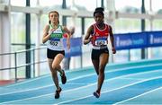 20 March 2022; Isabel Twomey of Raheny Shamrock AC, Dublin, left, and Vivian Amaeze of Dooneen AC, Limerick, competing in the women's U16 200m during day two of the Irish Life Health National Juvenile Indoors at the Athlone Institute of Technology in Athlone, Westmeath. Photo by Ben McShane/Sportsfile