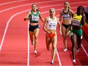 20 March 2022; Phil Healy of Ireland, left, on her way to finishing third in the women's 4x400m relay heats during day three of the World Indoor Athletics Championships at the Stark Arena in Belgrade, Serbia. Photo by Sam Barnes/Sportsfile