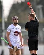 20 March 2022; Gerry Keegan of Kildare is shown a straight red card by referee Michael Kennedy for a tackle on Tommy Gallagher of Westmeath during the Allianz Hurling League Division 2A match between Kildare and Westmeath at St Conleth's Park in Newbridge, Kildare. Photo by Piaras Ó Mídheach/Sportsfile