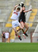 20 March 2022; John Cooper of Cork fields a high ball ahead of Liam Kerr of Down during the Allianz Football League Division 2 match between Cork and Down at Páirc Uí Chaoimh in Cork. Photo by Brendan Moran/Sportsfile