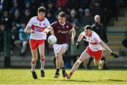 20 March 2022; Johnny Heaney of Galway in action against Paul Cassidy and Gareth McKinless of Derry during the Allianz Football League Division 2 match between Derry and Galway at Derry GAA Centre of Excellence in Owenbeg, Derry. Photo by Oliver McVeigh/Sportsfile