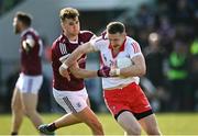 20 March 2022; Emmet Bradley of Derry in action against Johnny Heaney of Galway during the Allianz Football League Division 2 match between Derry and Galway at Derry GAA Centre of Excellence in Owenbeg, Derry. Photo by Oliver McVeigh/Sportsfile