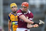 20 March 2022; Conor Whelan of Galway in action against Aaron Fitzgerald of Clare during the Allianz Hurling League Division 1 Group A match between Galway and Clare at Pearse Stadium in Galway. Photo by Ray Ryan/Sportsfile