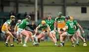 20 March 2022; Killian Sampson of Offaly in action against Gearoid Hegarty, left, and Graeme Mulcahy of Limerick during the Allianz Hurling League Division 1 Group A match between Limerick and Offaly at TUS Gaelic Grounds in Limerick. Photo by Seb Daly/Sportsfile