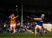 20 March 2022; Conor Stakelum of Tipperary takes a shot at goal under pressure from Keelan Molloy of Antrim during the Allianz Hurling League Division 1 Group B match between Tipperary and Antrim at Semple Stadium in Thurles, Tipperary. Photo by Harry Murphy/Sportsfile