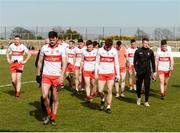 20 March 2022; The Derry players led by Christopher McKaigue leave the field after being defeated in the Allianz Football League Division 2 match between Derry and Galway at Derry GAA Centre of Excellence in Owenbeg, Derry. Photo by Oliver McVeigh/Sportsfile