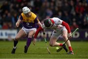 20 March 2022; Ger Collins of Cork in action against Oisín Pepper of Wexford during the Allianz Hurling League Division 1 Group A match between Wexford and Cork at Chadwicks Wexford Park in Wexford. Photo by Daire Brennan/Sportsfile