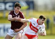 20 March 2022; Padraig McGrogan of Derry in action against Matthew Tierney of Galway during the Allianz Football League Division 2 match between Derry and Galway at Derry GAA Centre of Excellence in Owenbeg, Derry. Photo by Oliver McVeigh/Sportsfile