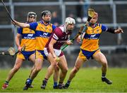 20 March 2022; Gearoid McInerney of Galway in action against Jack Browne and John Conlon of Clare during the Allianz Hurling League Division 1 Group A match between Galway and Clare at Pearse Stadium in Galway. Photo by Ray Ryan/Sportsfile