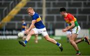 20 March 2022; Teddy Doyle of Tipperary in action against Niall Hickey of Carlow during the Allianz Football League Division 4 match between Tipperary and Carlow at Semple Stadium in Thurles, Tipperary. Photo by Harry Murphy/Sportsfile