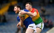 20 March 2022; Jimmy Feehan of Tipperary in action against Darragh Foley of Carlow during the Allianz Football League Division 4 match between Tipperary and Carlow at Semple Stadium in Thurles, Tipperary. Photo by Harry Murphy/Sportsfile