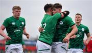 20 March 2022; Jude Postlethwaite of Ireland, second from right, celebrates with teammate Ben Carson after scoring their side's third try during the U20 Six Nations Rugby Championship match between Ireland and Scotland at Musgrave Park in Cork. Photo by Brendan Moran/Sportsfile