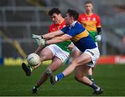 20 March 2022; Jordan Morrissey of Carlow in action against Jack Harney of Tipperary during the Allianz Football League Division 4 match between Tipperary and Carlow at Semple Stadium in Thurles, Tipperary. Photo by Harry Murphy/Sportsfile