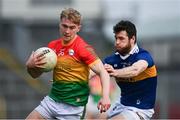20 March 2022; Ross Dunphy of Carlow in action against Shane O'Connell of Tipperary during the Allianz Football League Division 4 match between Tipperary and Carlow at Semple Stadium in Thurles, Tipperary. Photo by Harry Murphy/Sportsfile