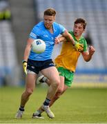 20 March 2022; Robert McDaid of Dublin in action against Peader Mogan of Donegal during the Allianz Football League Division 1 match between Dublin and Donegal at Croke Park in Dublin. Photo by Stephen McCarthy/Sportsfile