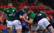 20 March 2022; Jack Boyle of Ireland is tackled by Mikey Jones and Josh Taylor of Scotland during the U20 Six Nations Rugby Championship match between Ireland and Scotland at Musgrave Park in Cork. Photo by Brendan Moran/Sportsfile