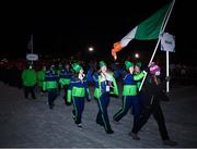 20 March 2022; Flagbearer Megan Ryan leads Team Ireland in the opening ceremony ahead of day one of the 2022 European Youth Winter Olympic Festival in Vuokatti, Finland. Photo by Eóin Noonan/Sportsfile
