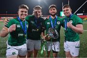20 March 2022; Ireland players, from left, James McCormick, Scott Wilson, Ben Carson and Jack Boyle celebrate with the U20 Six Nations championship trophy after the U20 Six Nations Rugby Championship match between Ireland and Scotland at Musgrave Park in Cork. Photo by Brendan Moran/Sportsfile