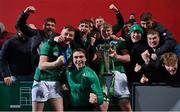 20 March 2022; Ireland players, from left, Fionn Gibbons, Shane Mallon and Conor O’Tighearnaigh and their friends celebrate with the U20 Six Nations championship trophy after the U20 Six Nations Rugby Championship match between Ireland and Scotland at Musgrave Park in Cork. Photo by Brendan Moran/Sportsfile