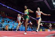 20 March 2022; Stephenie Ann McPherson of Jamaica crosses the line to win the women's 4x400m relay ahead of Femke Bol of Netherlands, who finished second, during day three of the World Indoor Athletics Championships at the Stark Arena in Belgrade, Serbia. Photo by Sam Barnes/Sportsfile