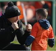 20 March 2022; Armagh manager Kieran McGeeney with match mascot Dáithí Mac Gabhann before the Allianz Football League Division 1 match between Armagh and Kerry at the Athletic Grounds in Armagh. Photo by Ramsey Cardy/Sportsfile