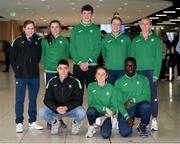 21 March 2022; Members of the Ireland team, back row, from left, Siofra Cleirigh Buttner, Phil Healy, Luke McCann, Sophie Becker and Sarah Lavin, with, front row, Darragh McElhinney, Sarah Healy and Israel Olatunde at Dublin Airport on the team's return from the World Indoor Athletics Championship in Serbia. Photo by Stephen McCarthy/Sportsfile