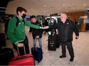 21 March 2022; Ireland's Luke McCann is geeted by Athletics Ireland president John Cronin at Dublin Airport on the team's return from the World Indoor Athletics Championship in Serbia. Photo by Stephen McCarthy/Sportsfile