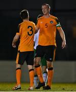 22 March 2022; Jack McMullen, right, and Glen Daly of Republic of Ireland Amateur Selection embrace after their side's victory in the friendly match between Republic of Ireland U20's and Republic of Ireland Amateur Selection at Home Farm FC in Dublin. Photo by Harry Murphy/Sportsfile