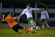 22 March 2022; Matt Healy of Republic of Ireland U20's has a shot on goal despite the tackle of Jimmy McHugh of Republic of Ireland Amateur Selection during the friendly match between Republic of Ireland U20's and Republic of Ireland Amateur Selection at Home Farm FC in Dublin. Photo by Harry Murphy/Sportsfile