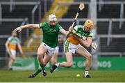 20 March 2022; Ciaran Burke of Offaly in action against Cian Lynch of Limerick during the Allianz Hurling League Division 1 Group A match between Limerick and Offaly at TUS Gaelic Grounds in Limerick. Photo by Seb Daly/Sportsfile