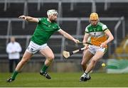 20 March 2022; Ciaran Burke of Offaly in action against Cian Lynch of Limerick during the Allianz Hurling League Division 1 Group A match between Limerick and Offaly at TUS Gaelic Grounds in Limerick. Photo by Seb Daly/Sportsfile